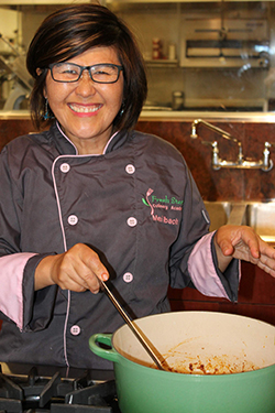 Mei cooking in the kitchen